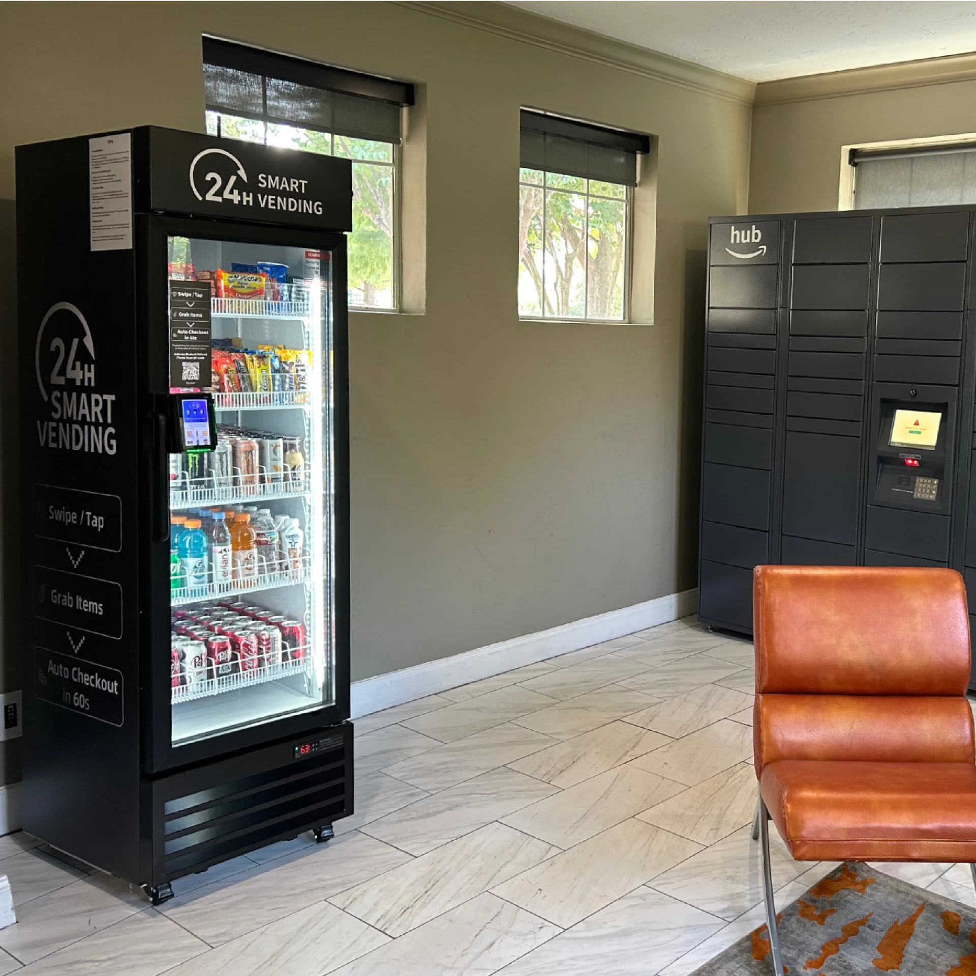 Thrive Vending 24H smart vending cooler stocked with snacks and drinks in an apartment lobby